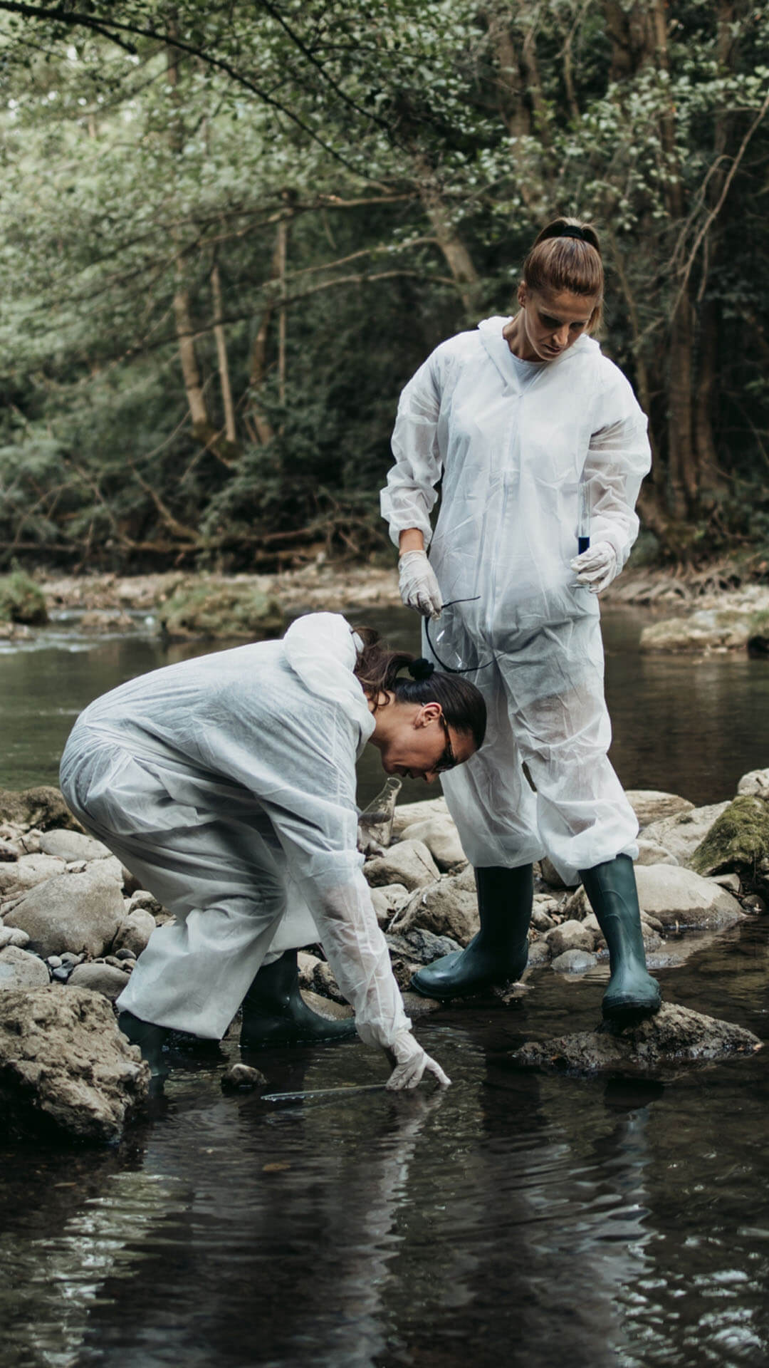 Two scientists testing the quality of the river